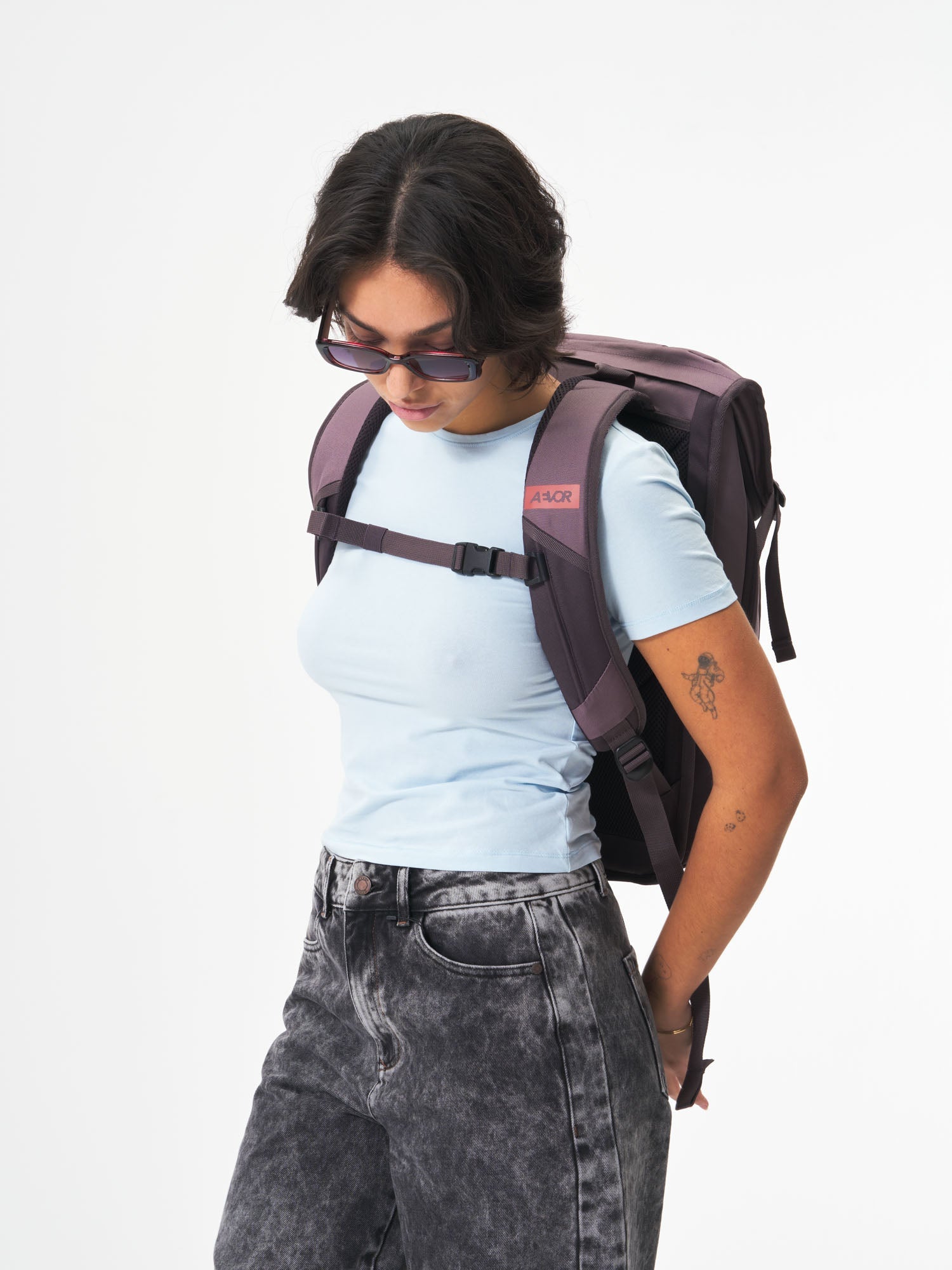 AEVOR-Daypack-Oxy-Purple-model-female-back