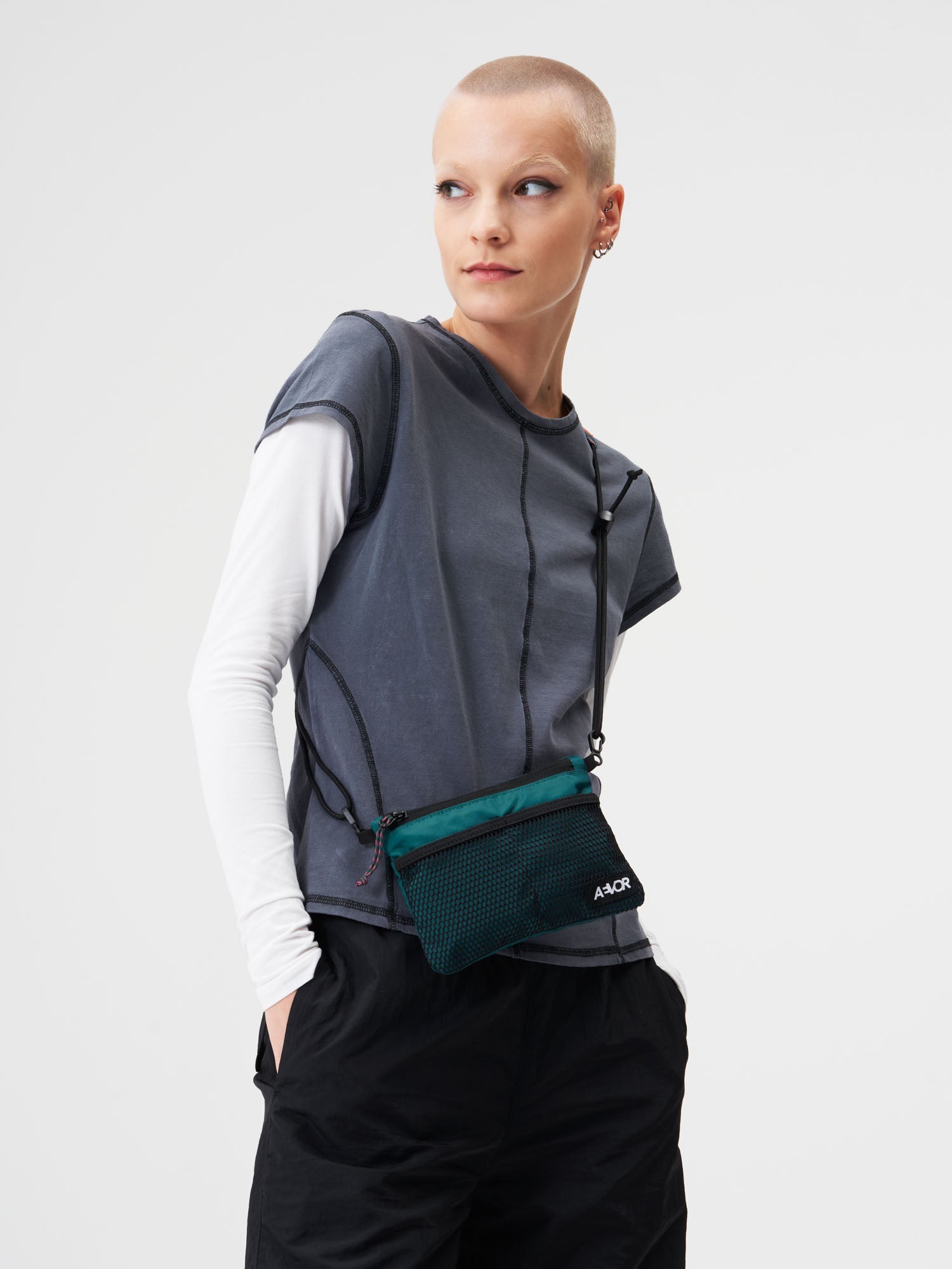 AEVOR-Chest-Pouch-Ripstop-Evergreen-model-female-front