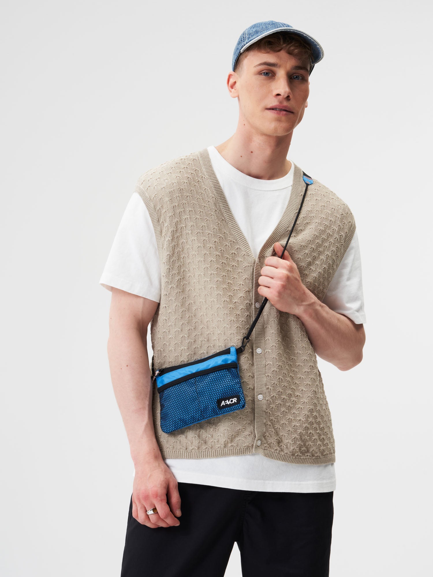 AEVOR-Chest-Pouch-Ripstop-Retro-Blue-model-male-front