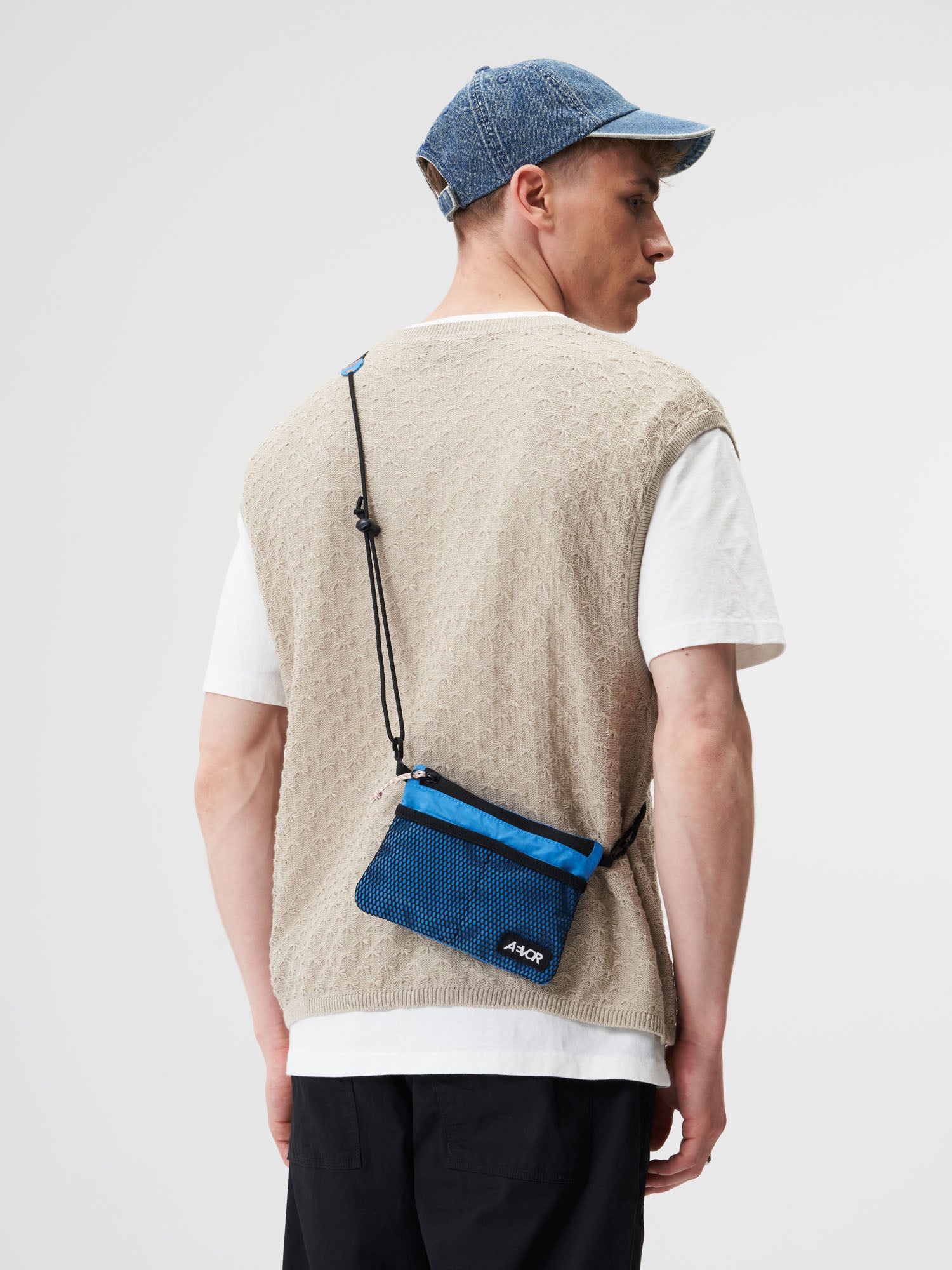 AEVOR-Chest-Pouch-Ripstop-Retro-Blue-model-male-front