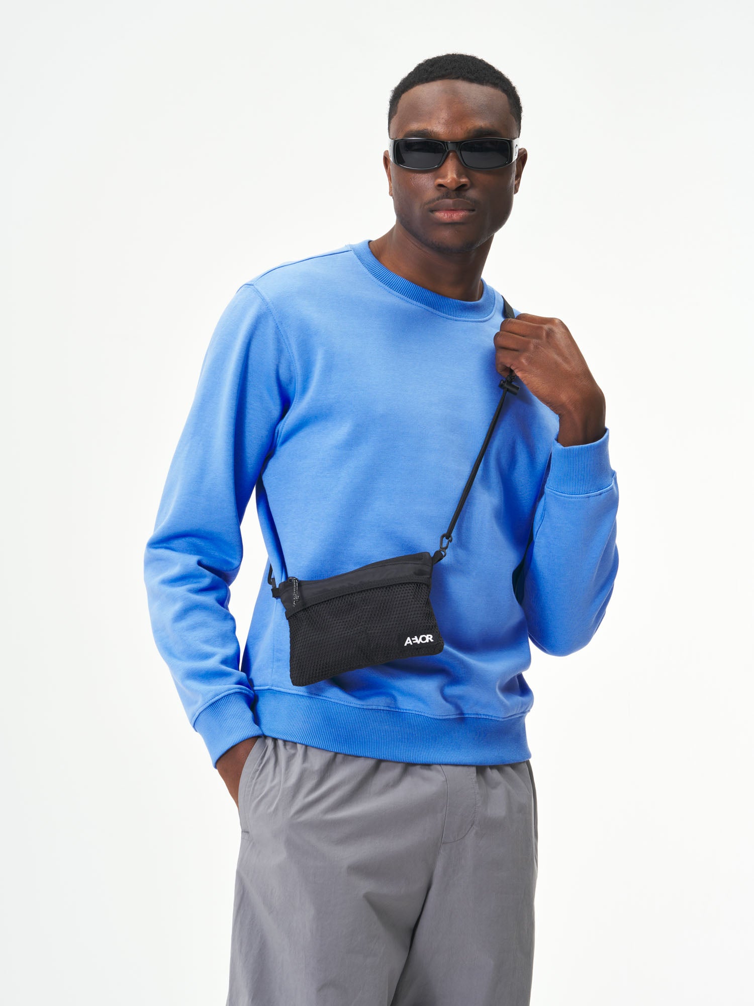 AEVOR-Chest-Pouch-Ripstop-Black-model-male-front