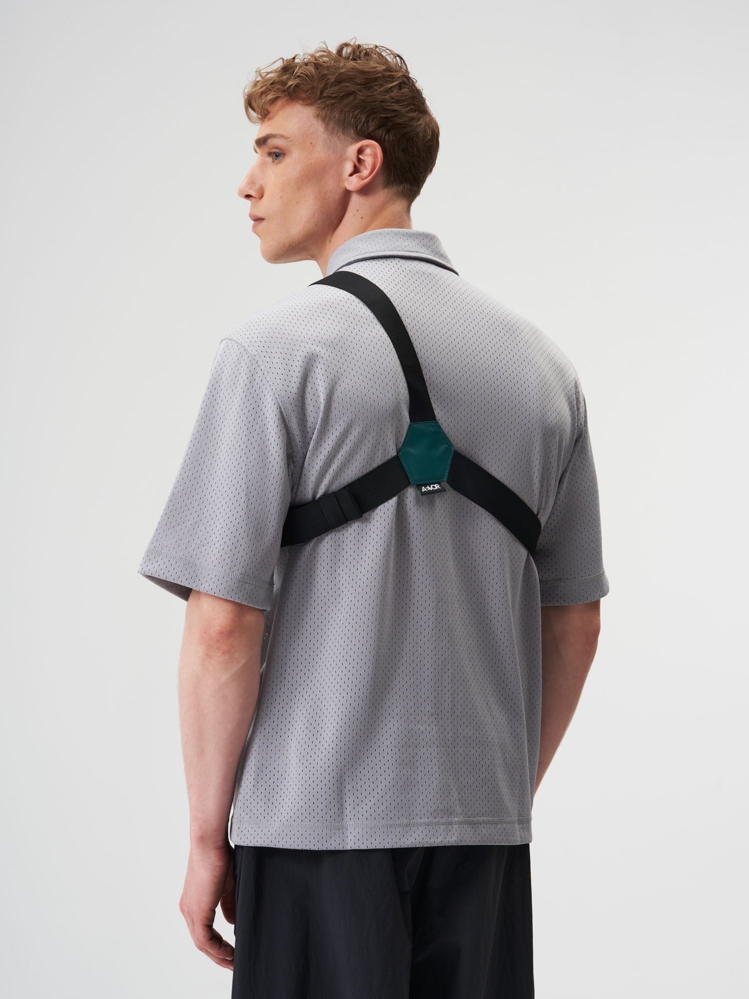 AEVOR-Front-Pack-Ripstop-Evergreen-model-male-back