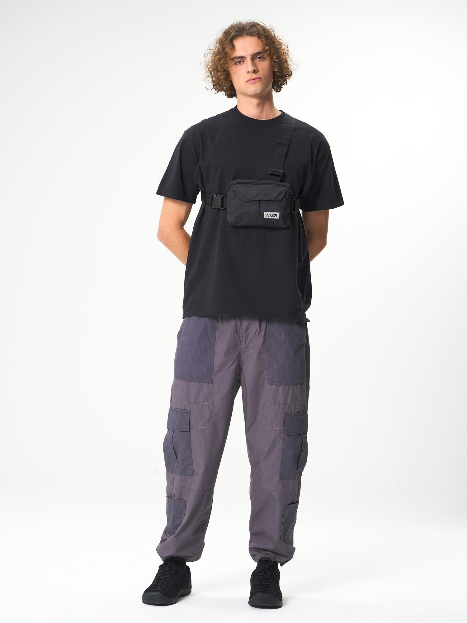 AEVOR-Front-Pack-Ripstop-Black-model-front