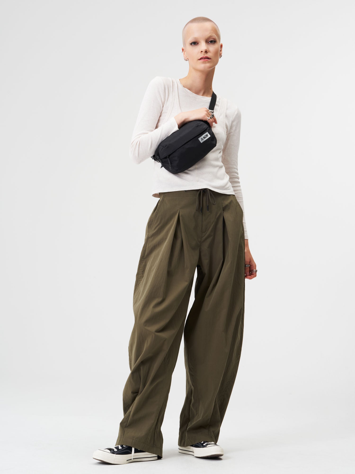 AEVOR-Hip-Bag-Ease-Ripstop-Black-model-female-front