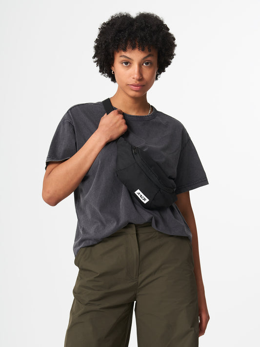 AEVOR-Hip-Bag-Black-Eclipse-model-front