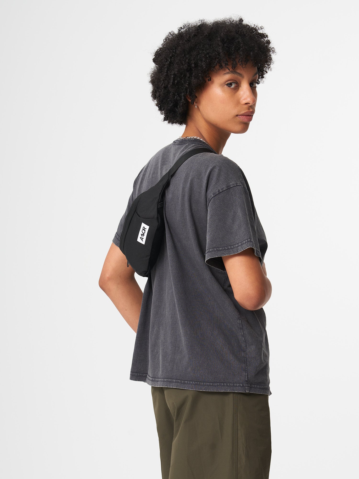AEVOR-Hip-Bag-Black-Eclipse-model-front