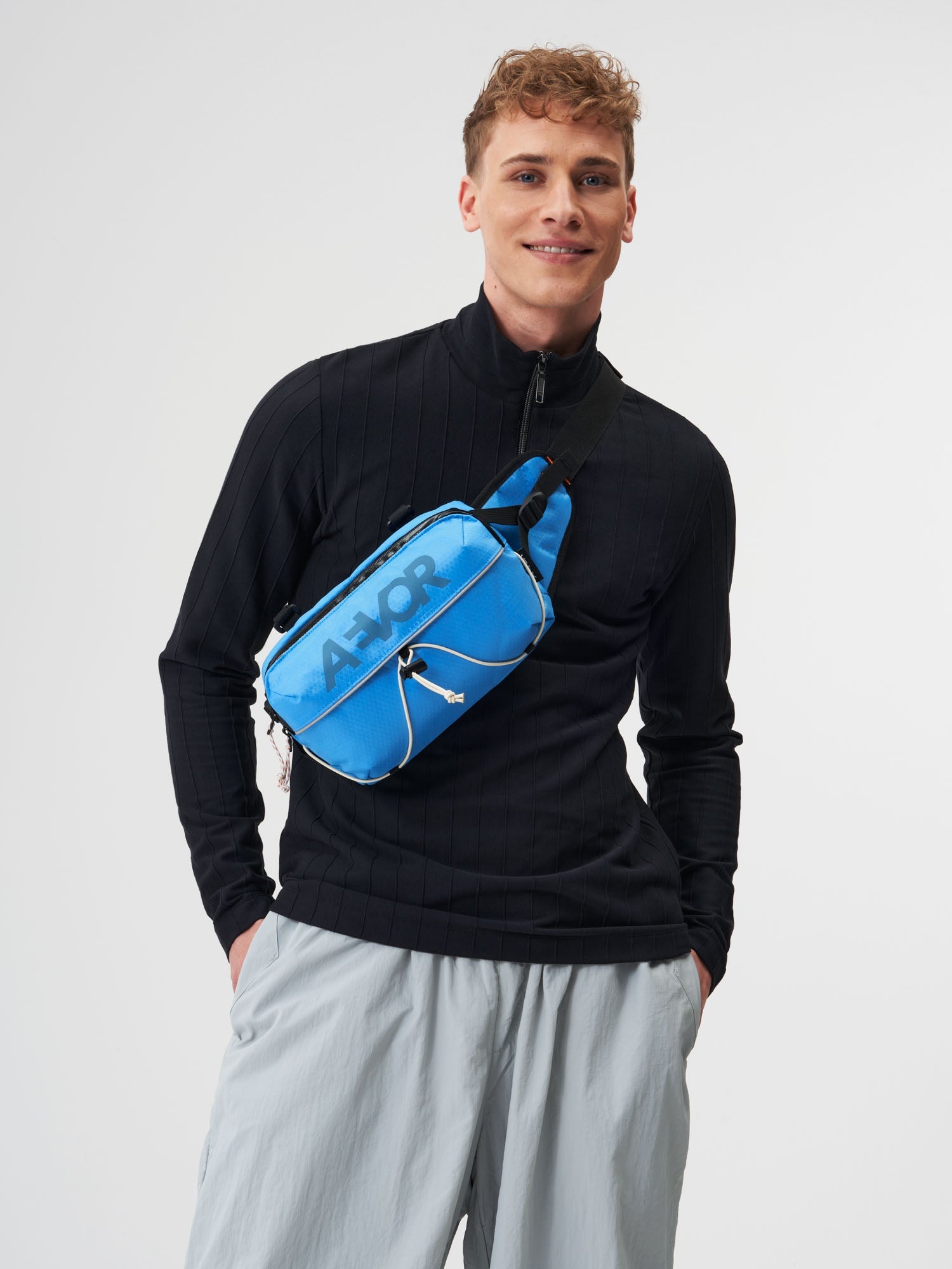 AEVOR-Bar-Bag-Proof-Retro-Blue-model-male-front