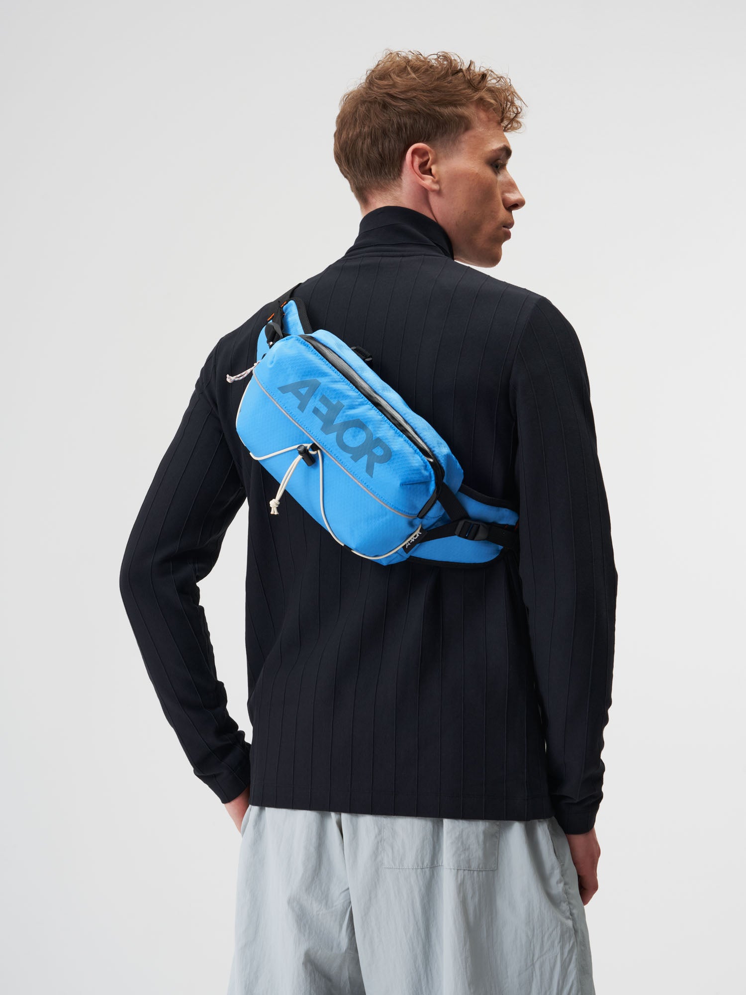 AEVOR-Bar-Bag-Proof-Retro-Blue-model-male-front