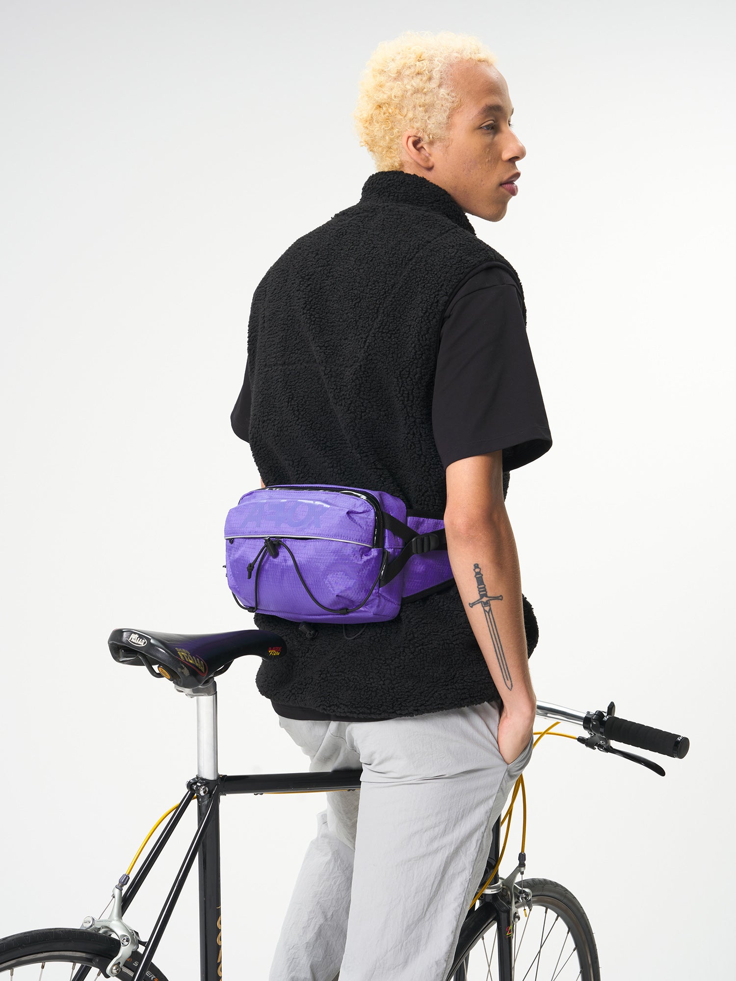 AEVOR-Bar-Bag-Proof-Purple-model-front