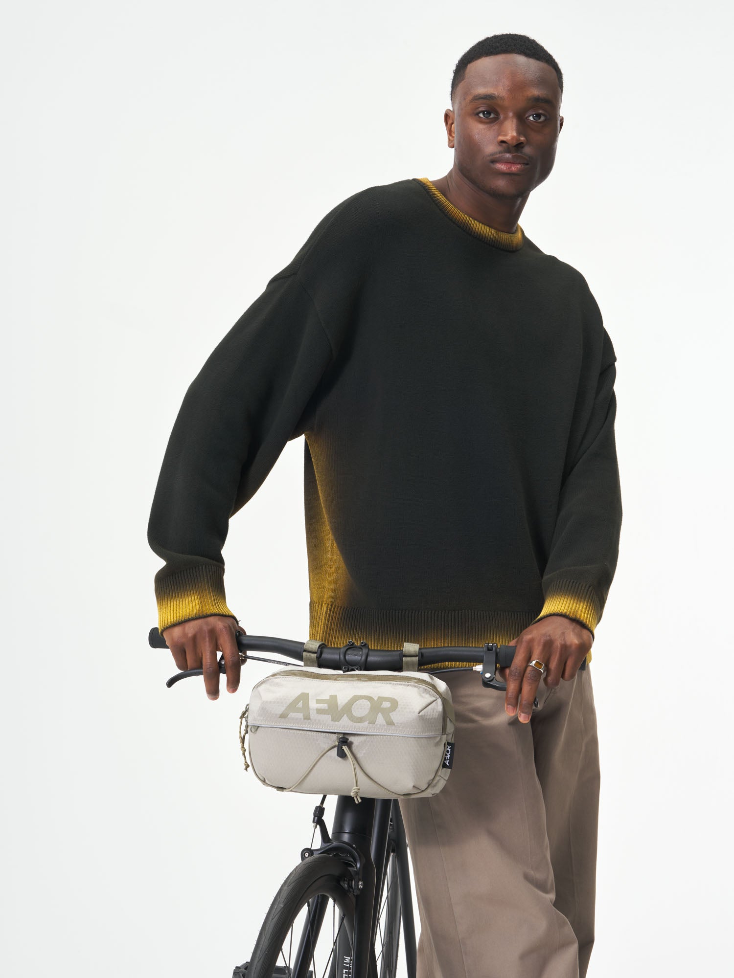 AEVOR-Bar-Bag-Proof-Sesame-Olive-model-male-front-details