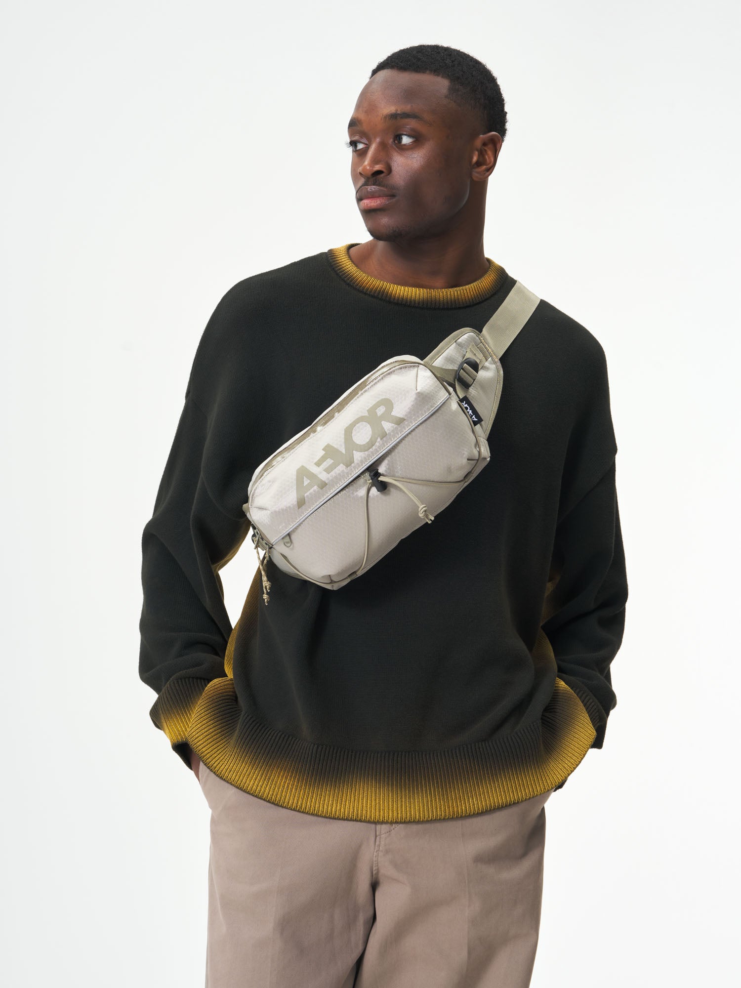 AEVOR-Bar-Bag-Proof-Sesame-Olive-model-male-front