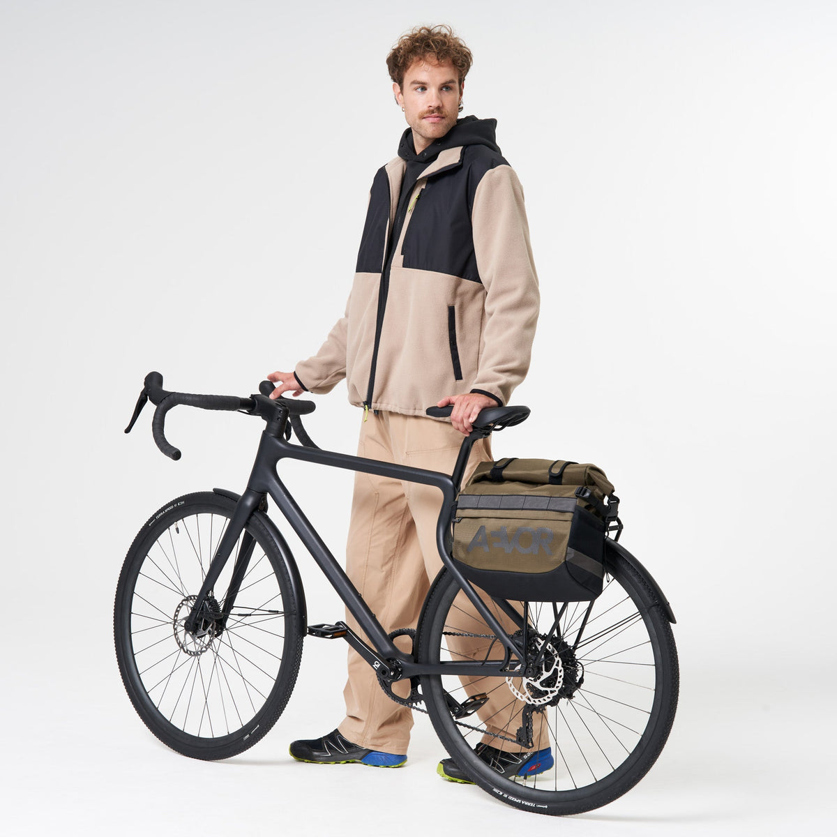 AEVOR-Triple-Bike-Bag-Proof-Olive-Gold-model-front