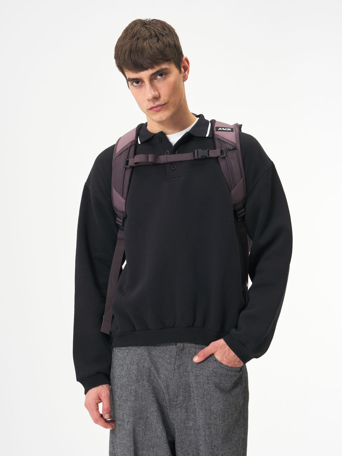 AEVOR-Roll-Pack-Oxy-Purple-model-female-back