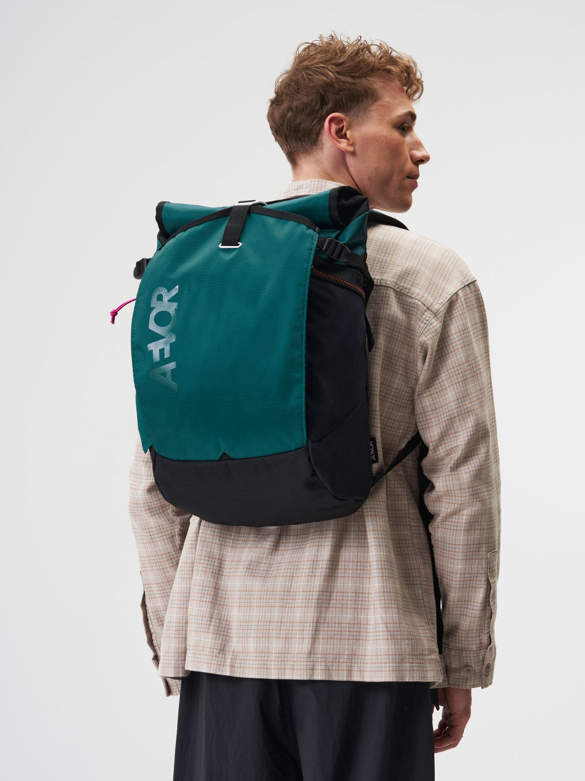 AEVOR-Roll-Pack-Proof-Evergreen-model-female-front