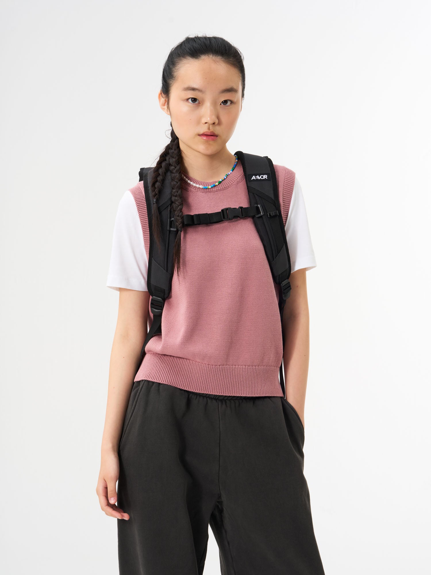 AEVOR-Roll-Pack-Pink-Icing-model-back