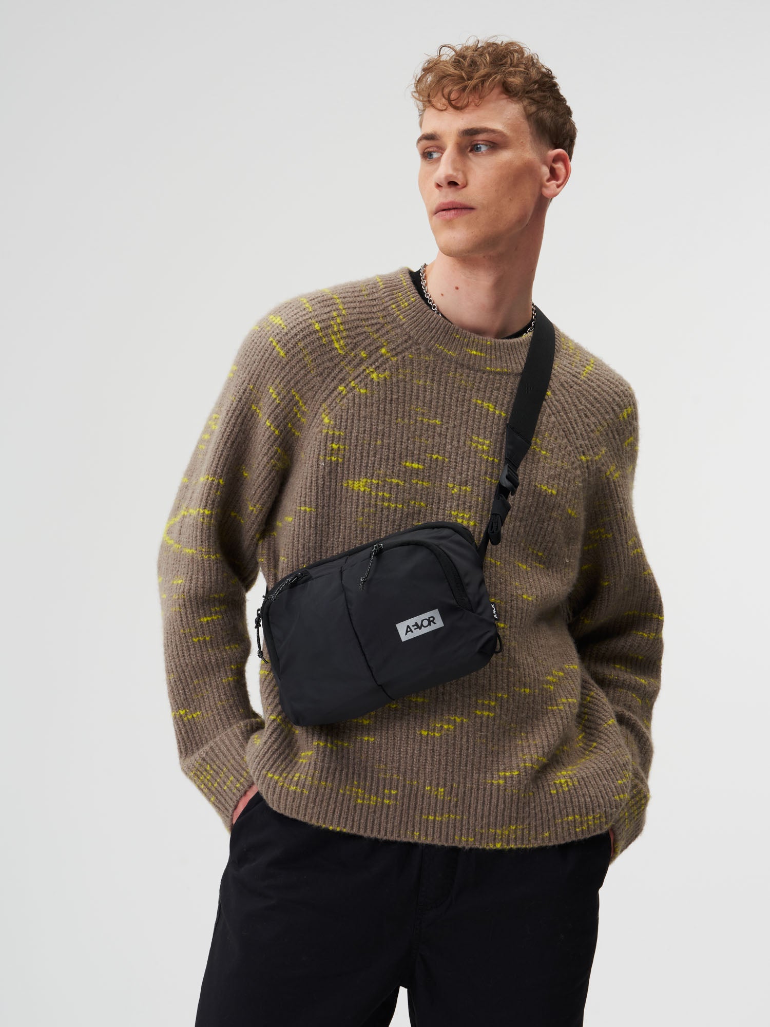 AEVOR-Sacoche-Bag-Ripstop-Black-model-male-front