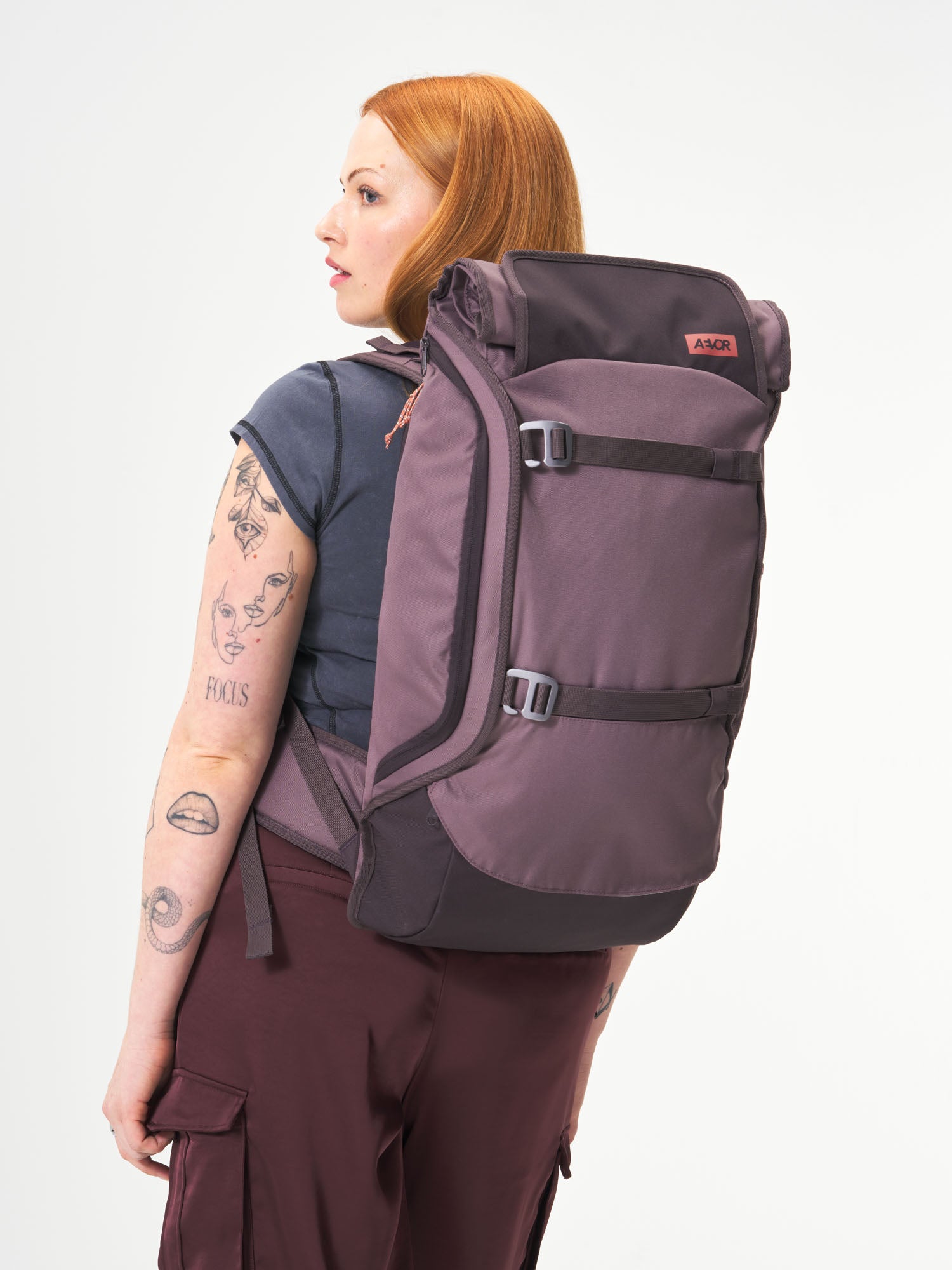 AEVOR-Travel-Pack-Oxy-Purple-model-female-front