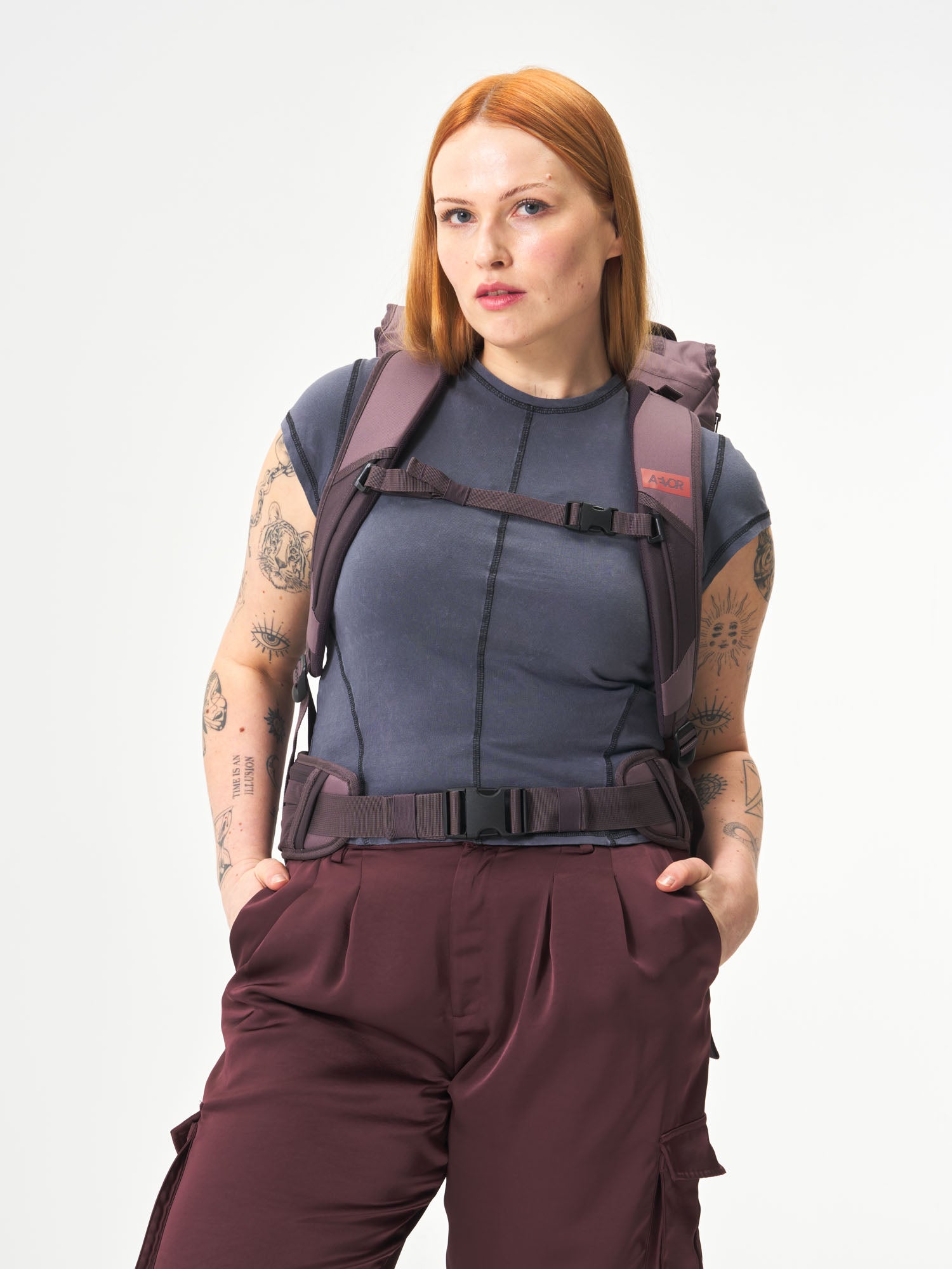 AEVOR-Travel-Pack-Oxy-Purple-model-female-back