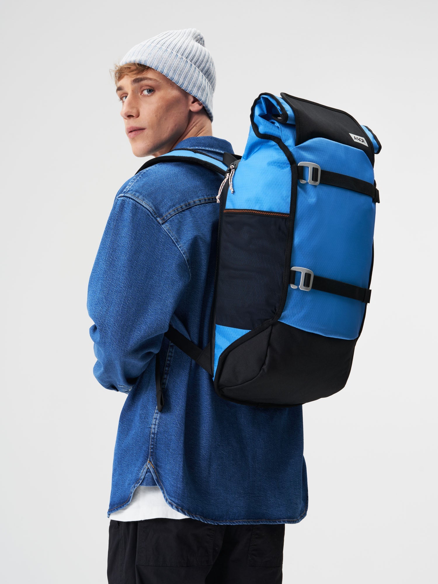 AEVOR-Trip-Pack-Proof-Retro-Blue-model-male-front