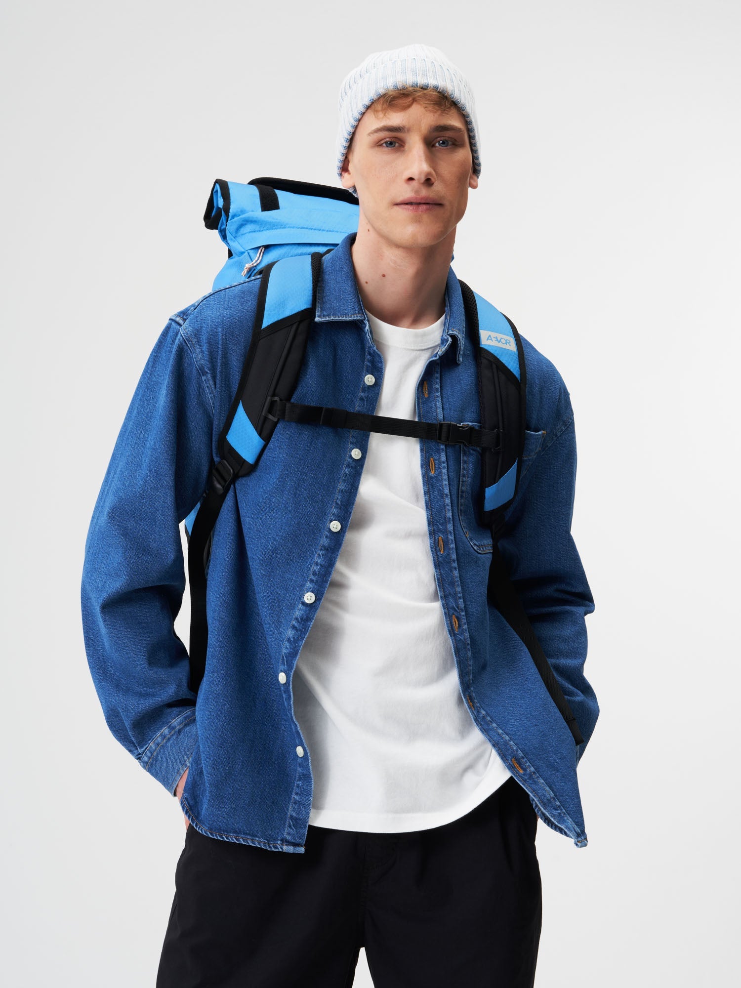 AEVOR-Trip-Pack-Proof-Retro-Blue-model-male-back