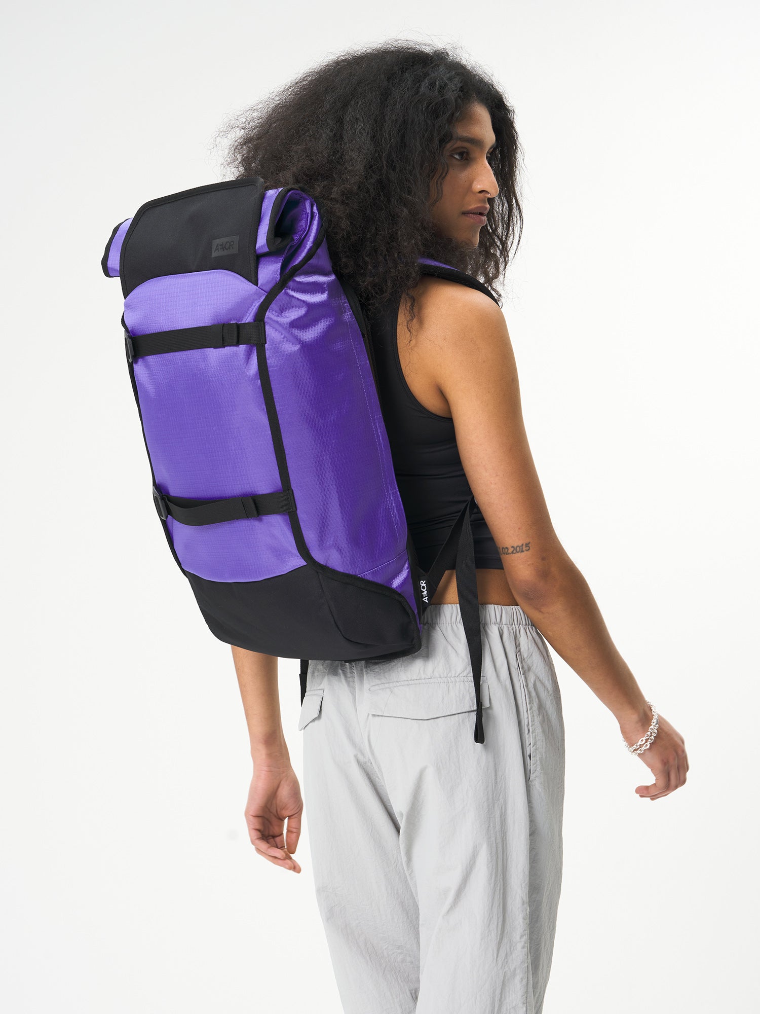 AEVOR-Trip-Pack-Proof-Purple-model-front