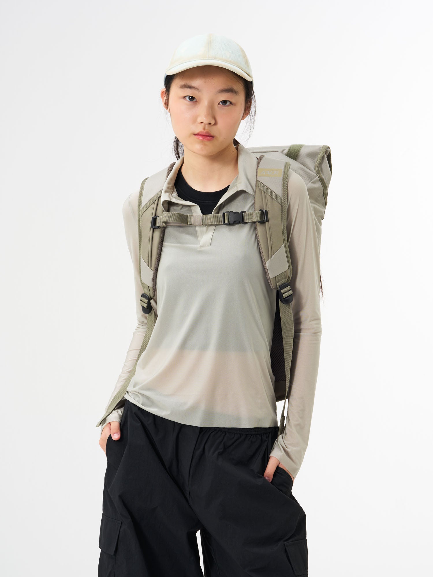 AEVOR-Trip-Pack-Proof-Sesame-Olive-model-back