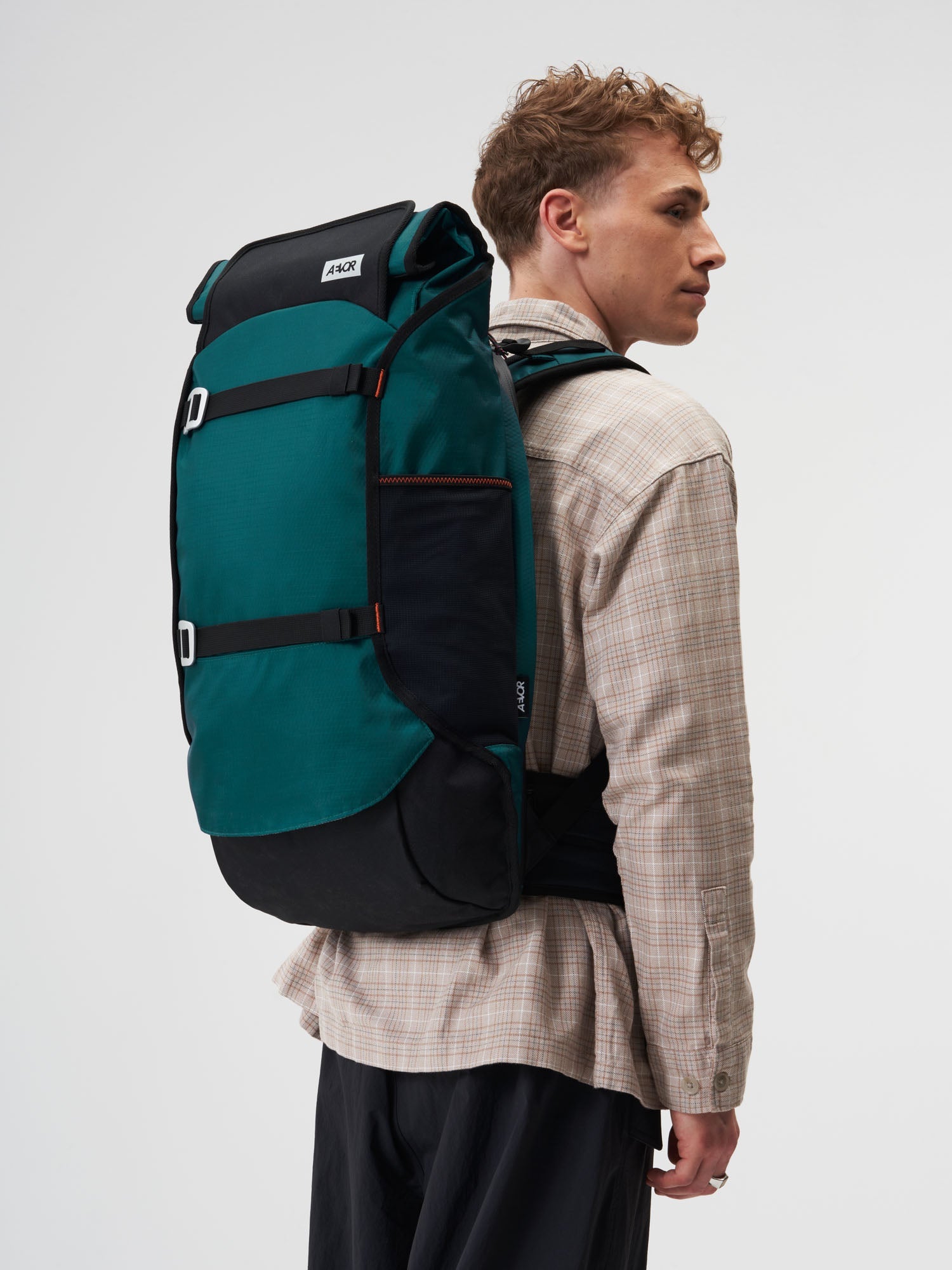 AEVOR-Travel-Pack-Proof-Evergreen-model-male-front