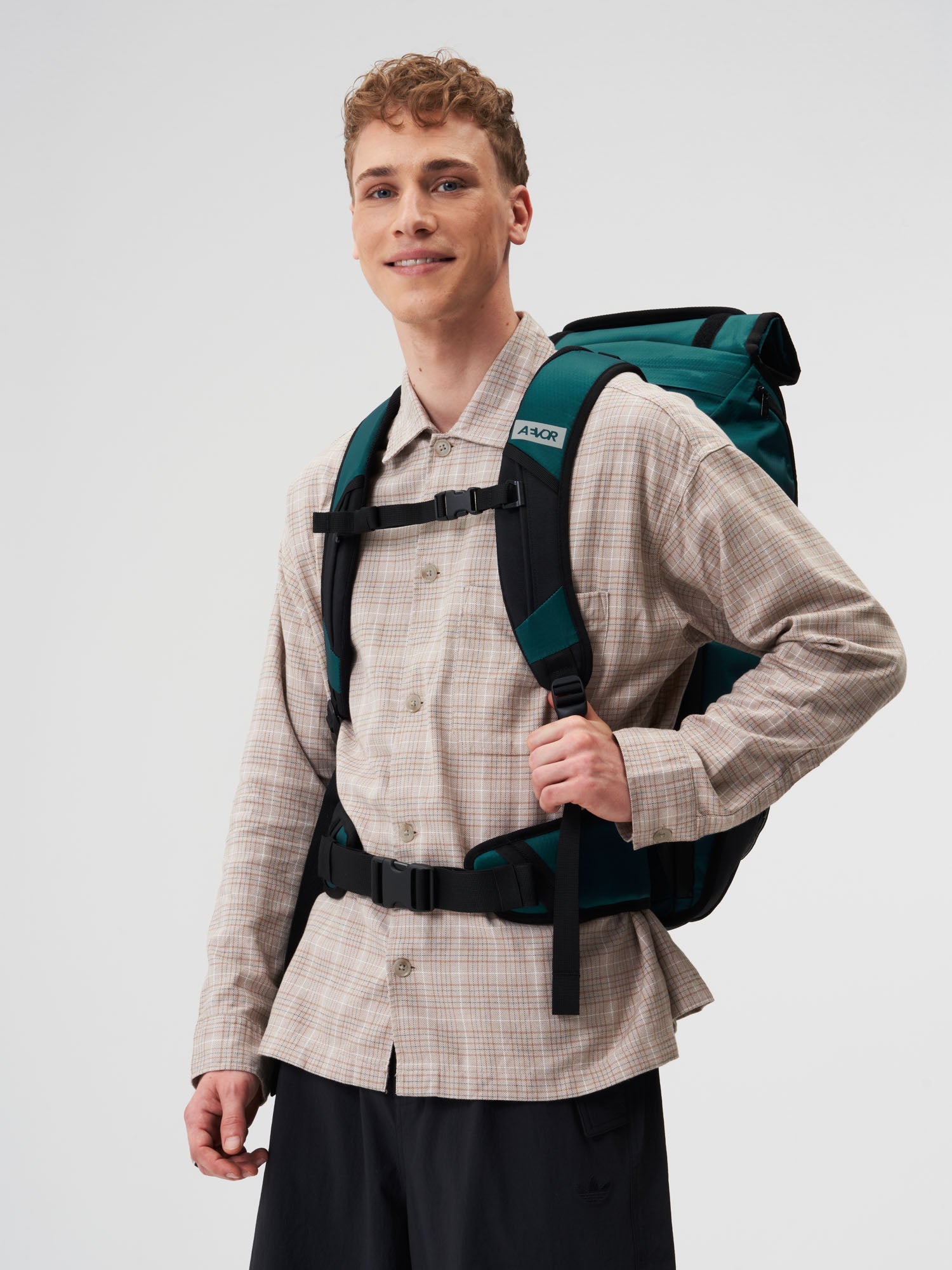 AEVOR-Travel-Pack-Proof-Evergreen-model-male-back