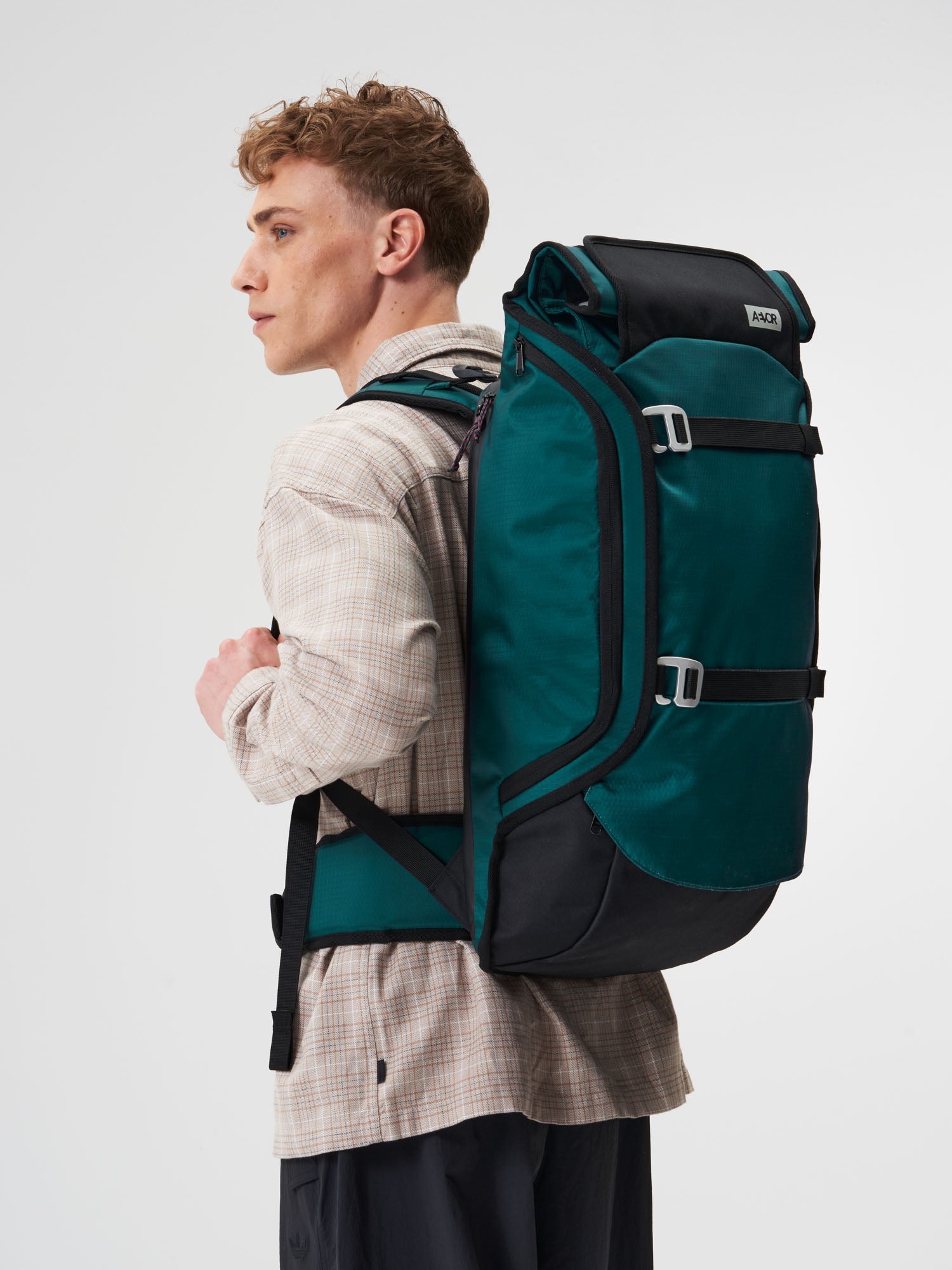 AEVOR-Travel-Pack-Proof-Evergreen-model-male-side