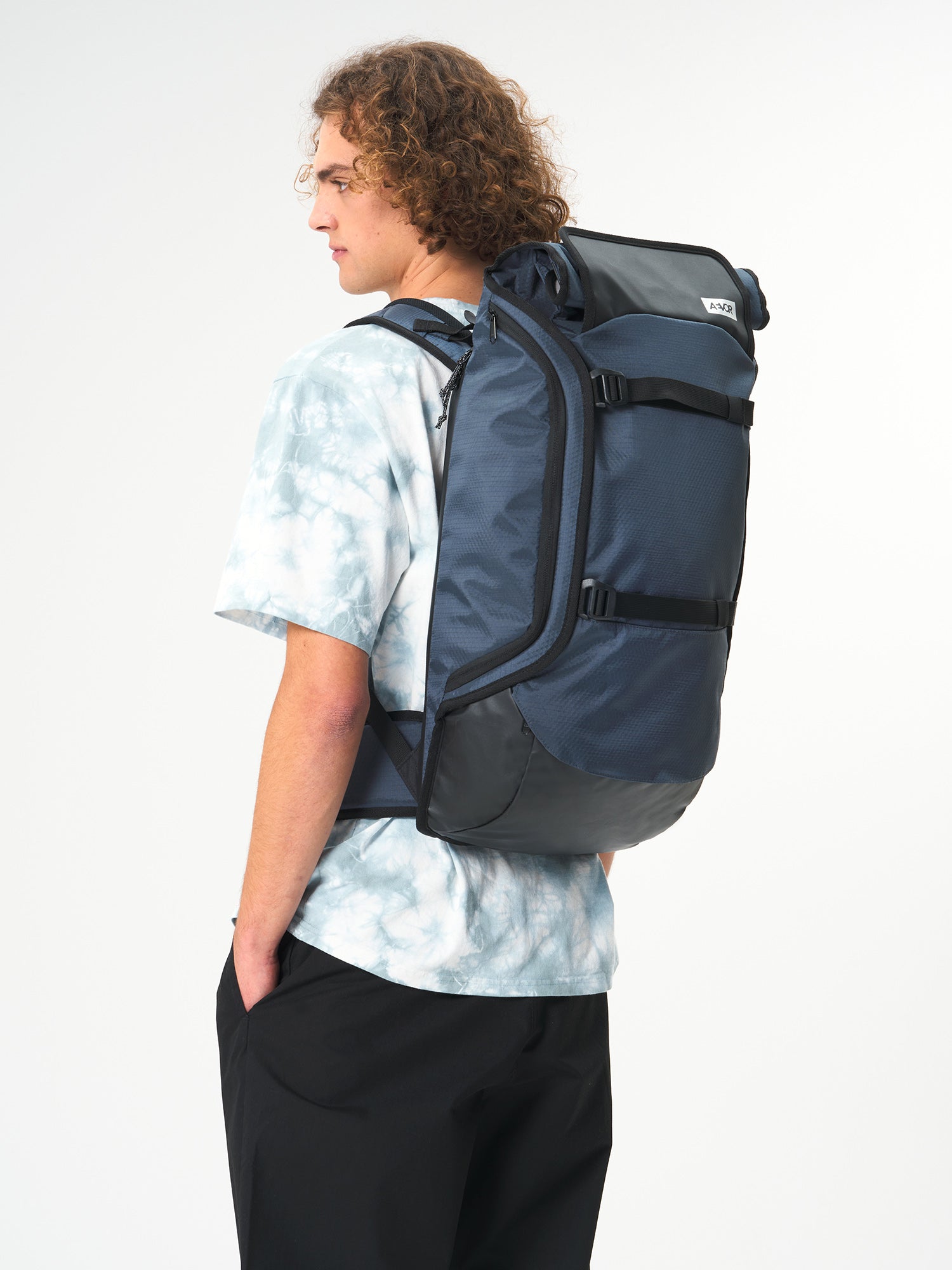 AEVOR-Travel-Pack-Proof-Petrol-model-side