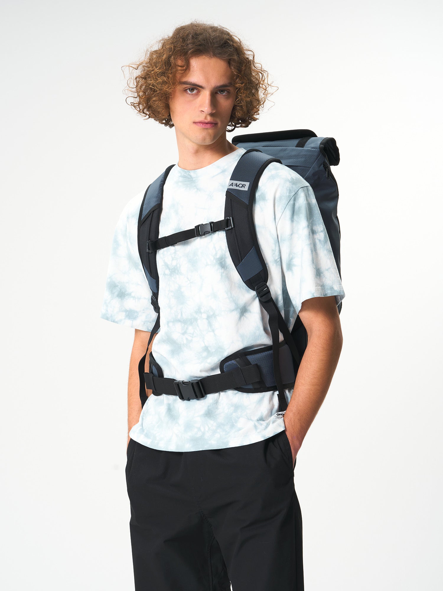 AEVOR-Travel-Pack-Proof-Petrol-model-back