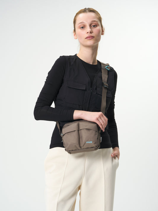 AEVOR-UT-Pouch-Utility-Coffee-Brown-model-front