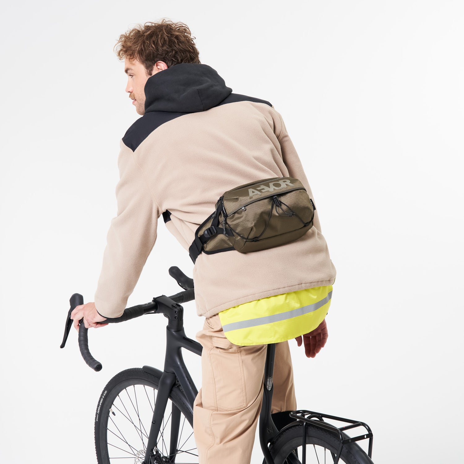 AEVOR-Bar-Bag-Proof-Olive-Gold-model-side