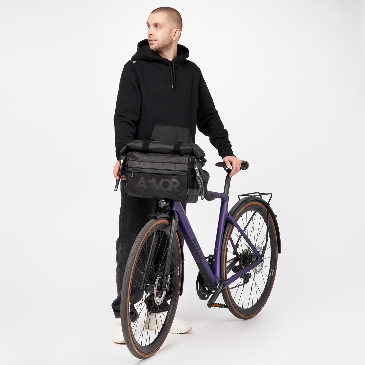 AEVOR-Triple-Bike-Bag-Proof-Black-model-front