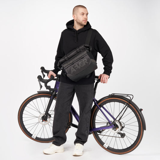 AEVOR-Triple-Bike-Bag-Proof-Black-model-front