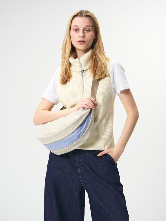 AEVOR-Bike-Sling-Bag-Off-White-model-front