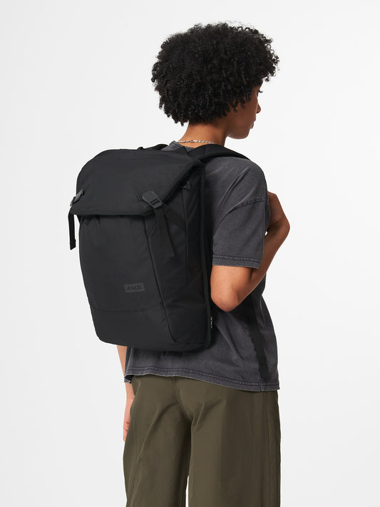 AEVOR-Daypack-Black-Eclipse-model-front