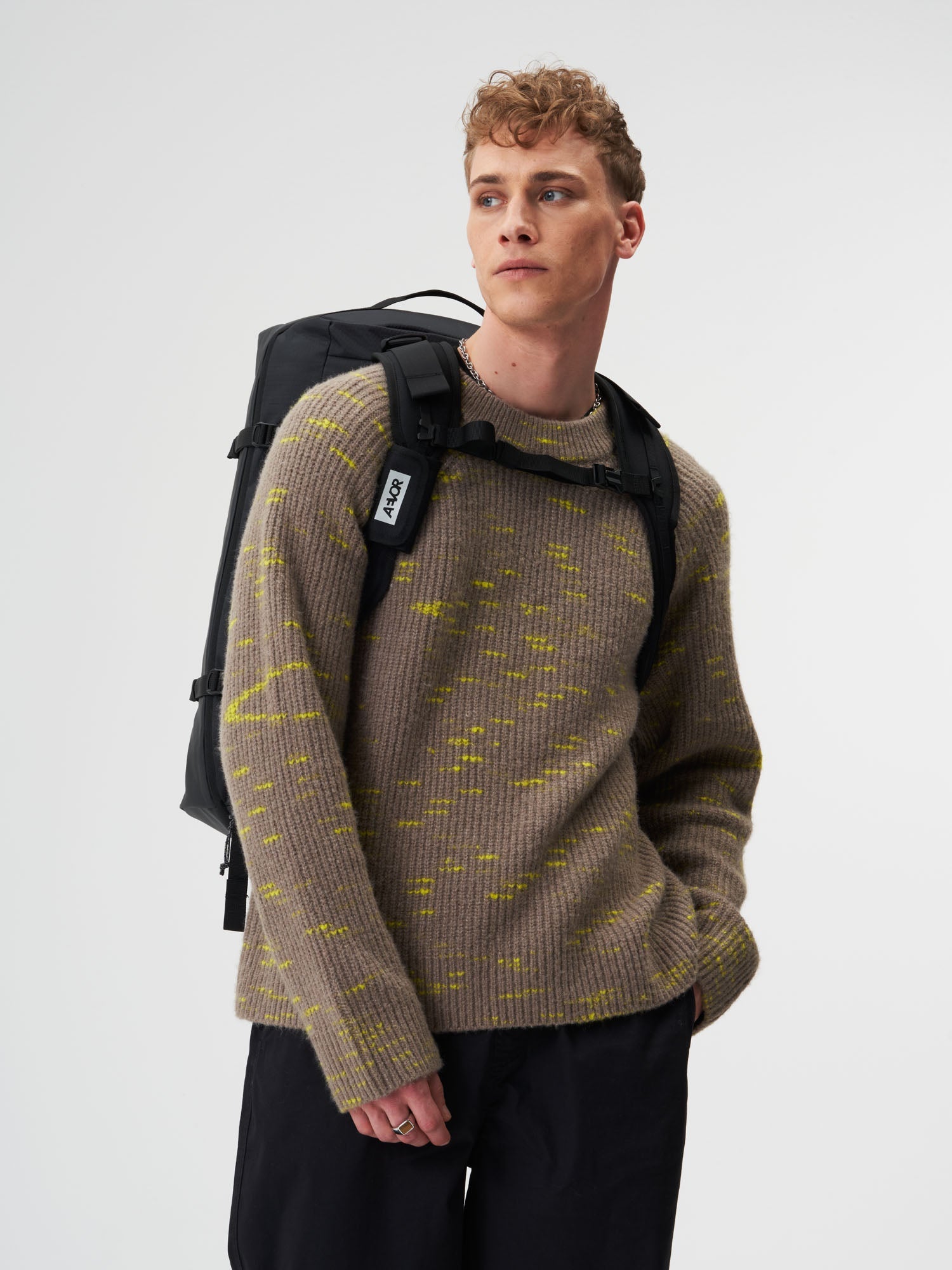 AEVOR-Duffel-Pack-Proof-Black-model-male-back