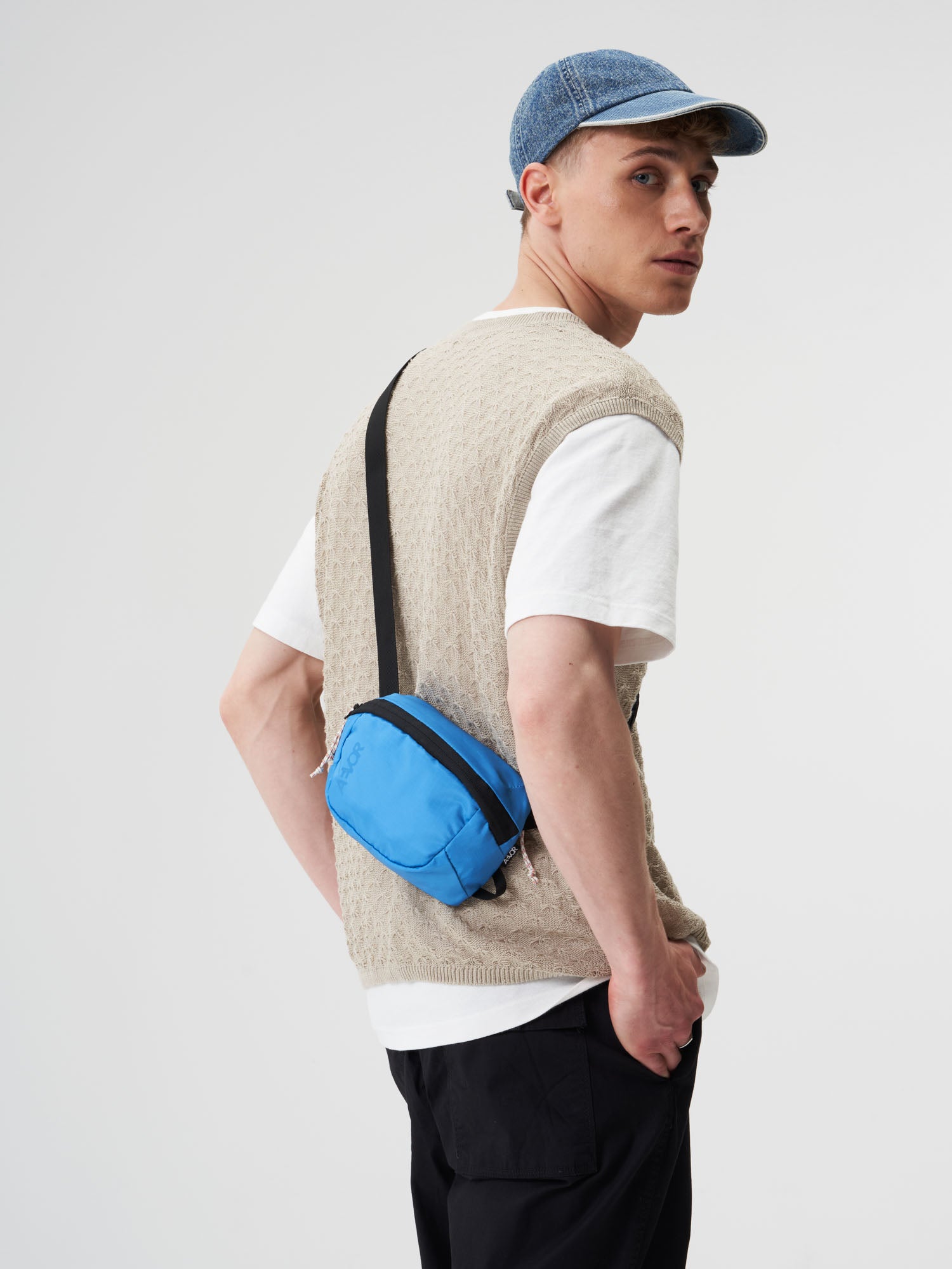 AEVOR-Hip-Bag-Move-Ripstop-Retro-Blue-model-male-front
