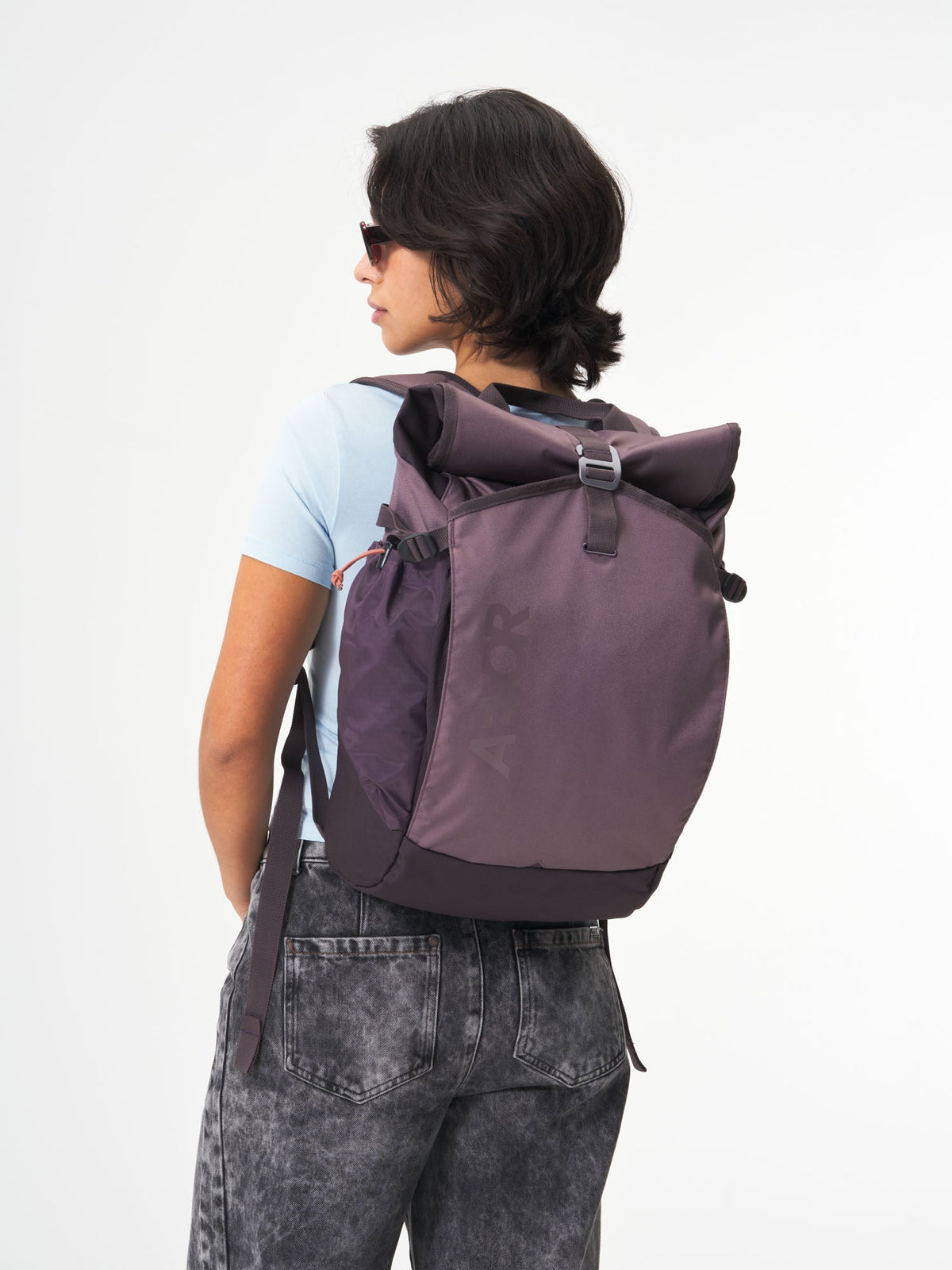 AEVOR-Roll-Pack-Oxy-Purple-model-female-front
