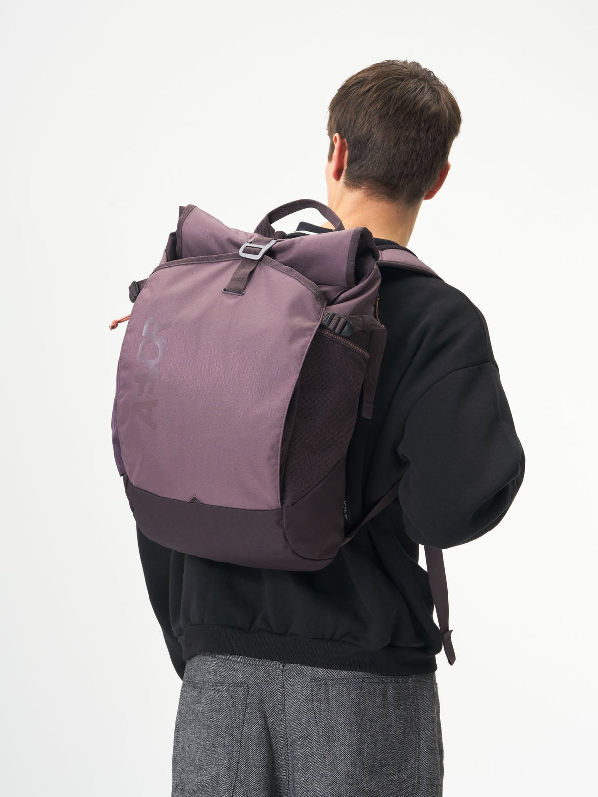 AEVOR-Roll-Pack-Oxy-Purple-model-male-front