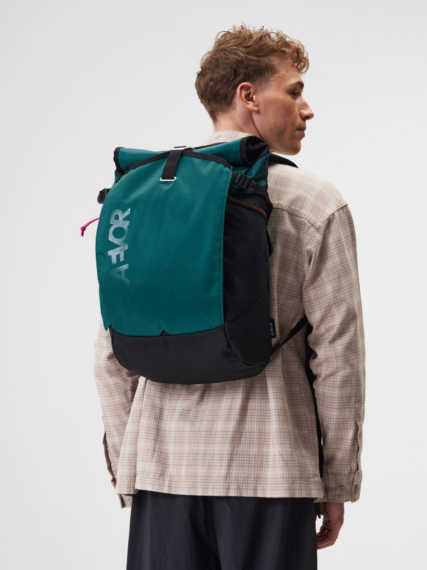 AEVOR-Roll-Pack-Proof-Evergreen-model-female-front