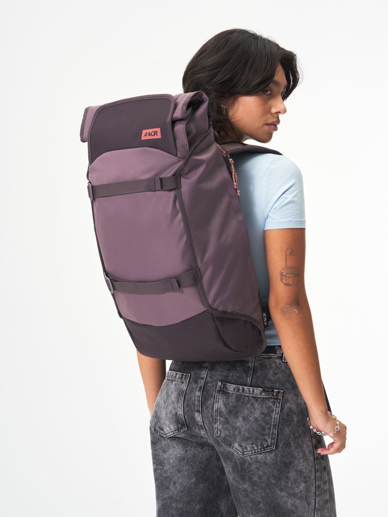 AEVOR-Trip-Pack-Oxy-Purple-model-female-front