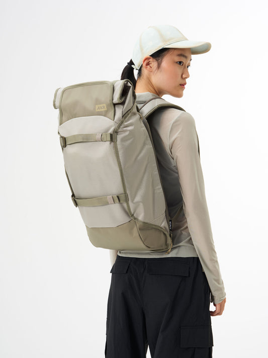 AEVOR-Trip-Pack-Proof-Sesame-Olive-model-front