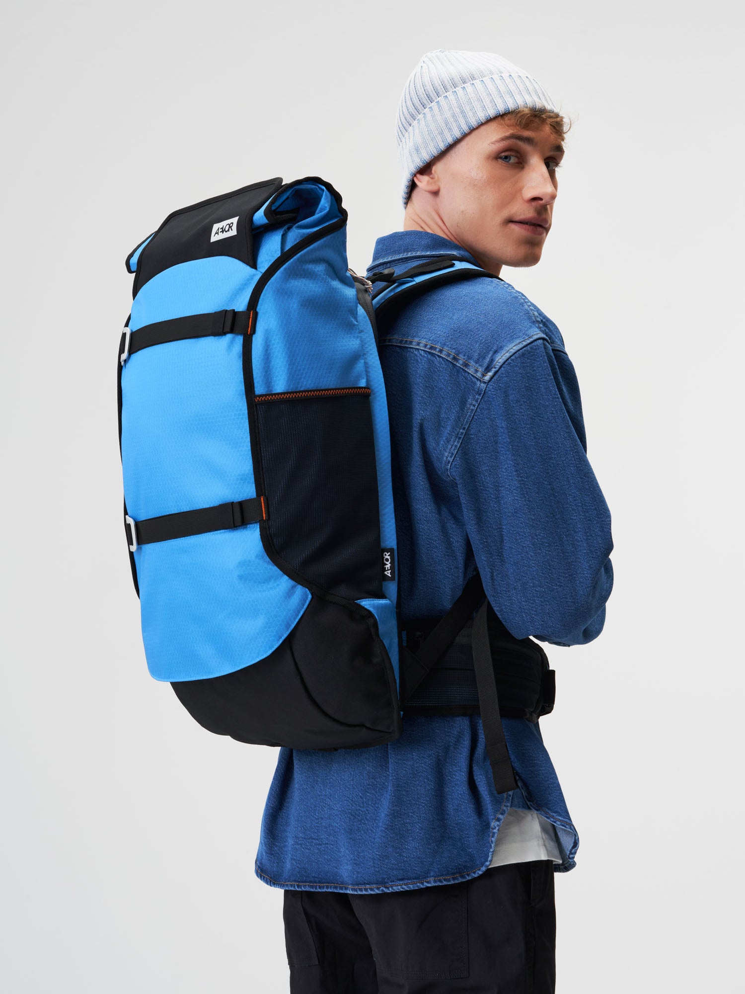 AEVOR-Travel-Pack-Proof-Retro-Blue-model-male-front