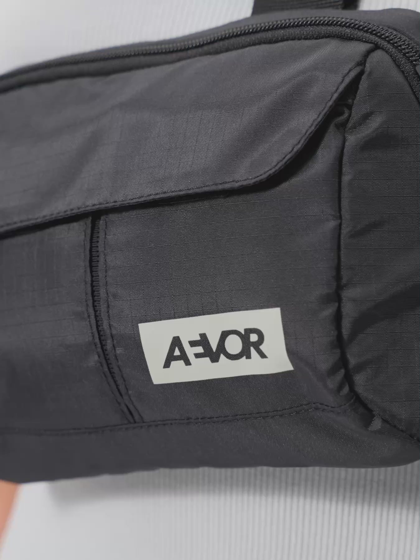 AEVOR-Front-Pack-Ripstop-Black-model-video