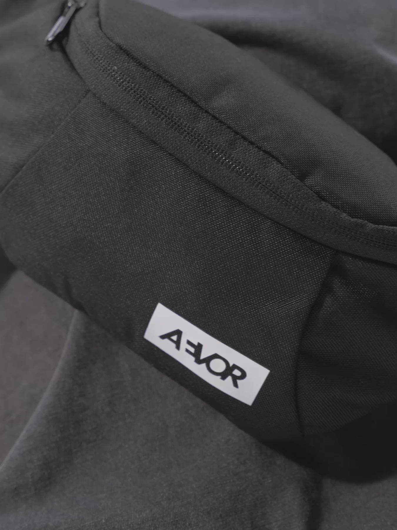 AEVOR-Hip-Bag-Black-Eclipse-front-closeup