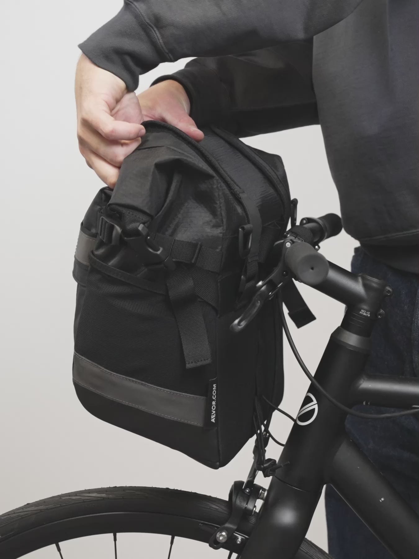 AEVOR-Triple-Bike-Bag-Proof-Olive-Gold-model-video