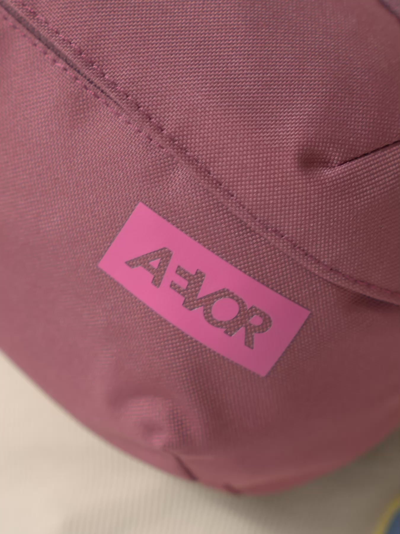 AEVOR-Hip-Bag-Ease-Raw-Ruby-model-video