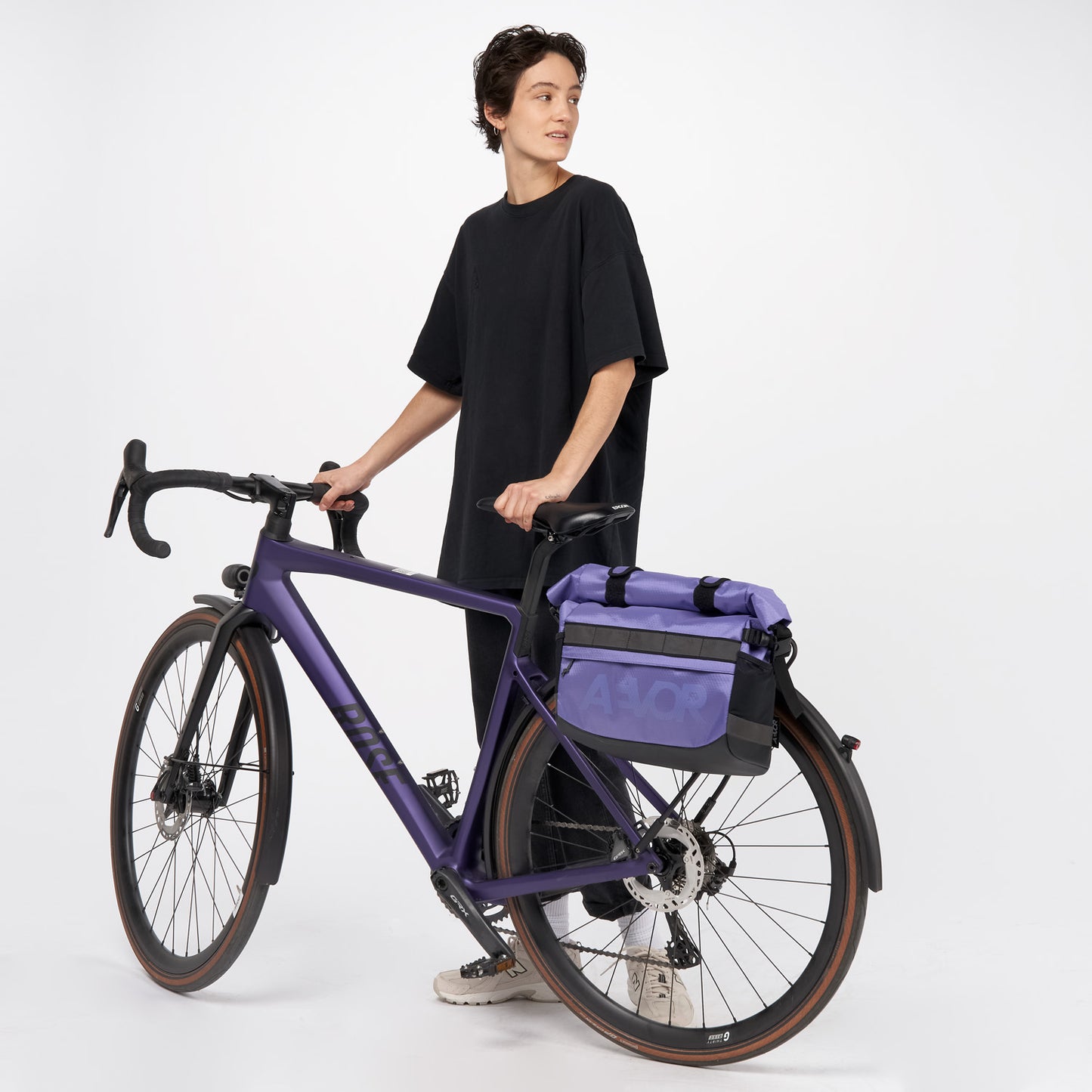 AEVOR-Triple-Bike-Bag-Proof-Purple-model-front